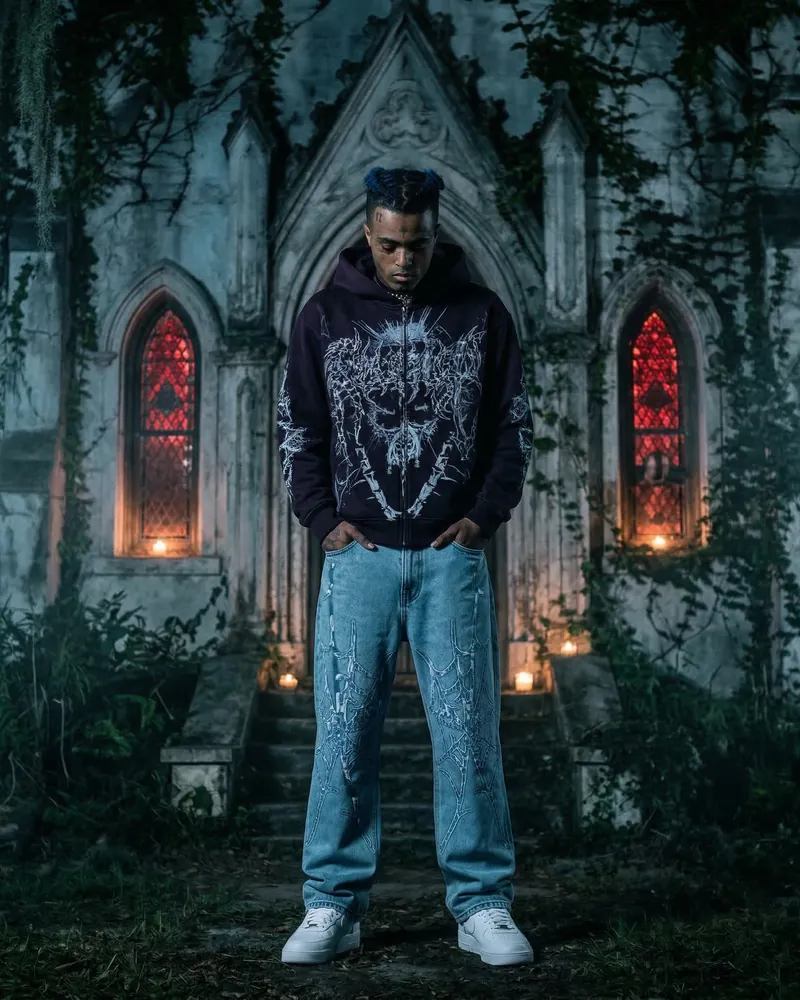 AI fashion photo: a model in a streetwear hoodie and jeans in front of a chapel with red windows, pose 6 of 6
